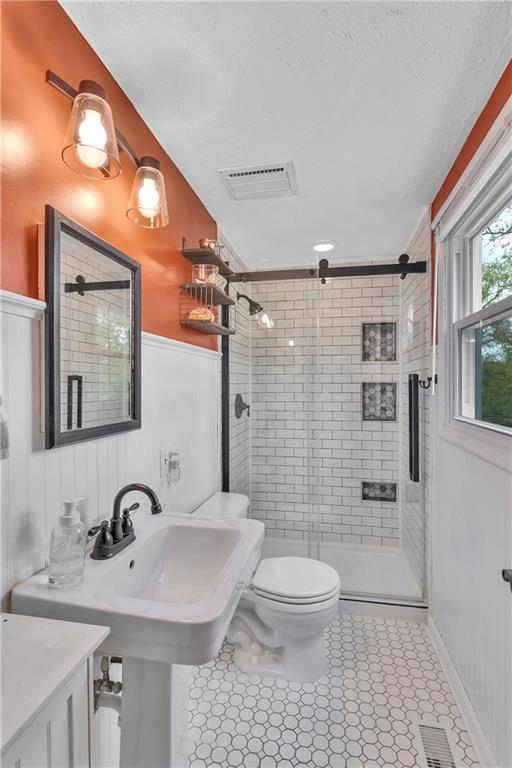 645 Blue Ridge Road Pittsburgh, PA 15239 - Photo 14 of 27 a bathroom with a sink a toilet and shower