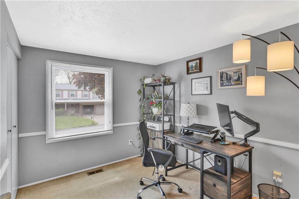 645 Blue Ridge Road Pittsburgh, PA 15239 - Photo 15 of 27 a view of a workspace with furniture and a window