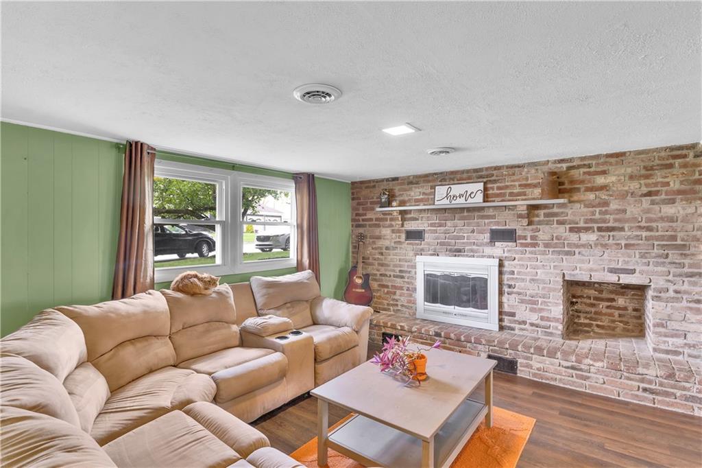 645 Blue Ridge Road Pittsburgh, PA 15239 - Photo 18 of 27 a living room with furniture and a fireplace
