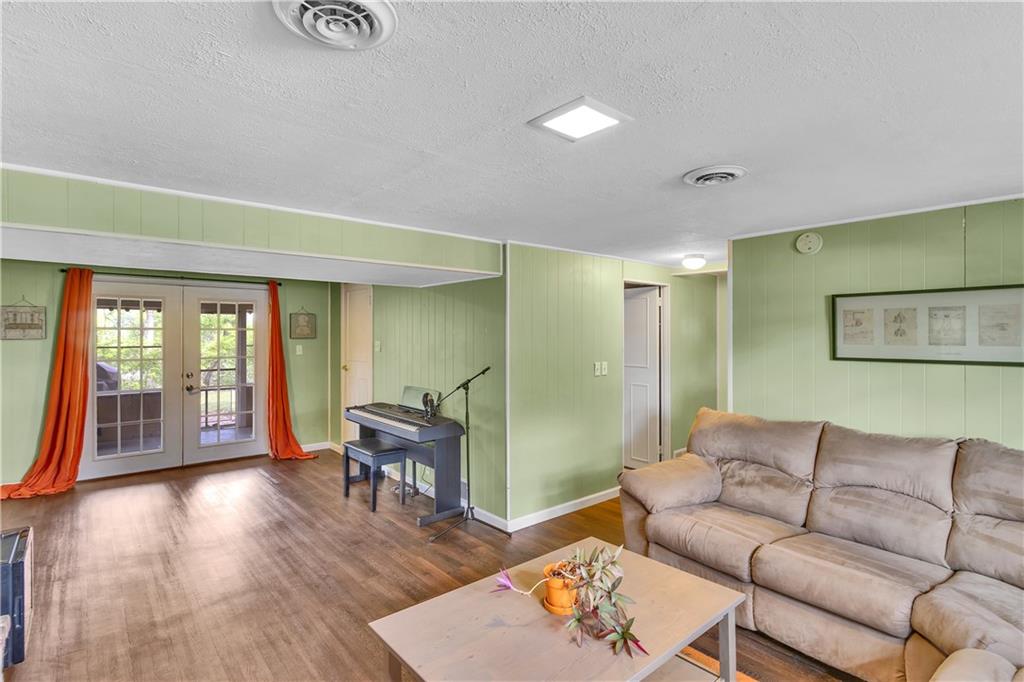 645 Blue Ridge Road Pittsburgh, PA 15239 - Photo 19 of 27 a living room with furniture and wooden floor