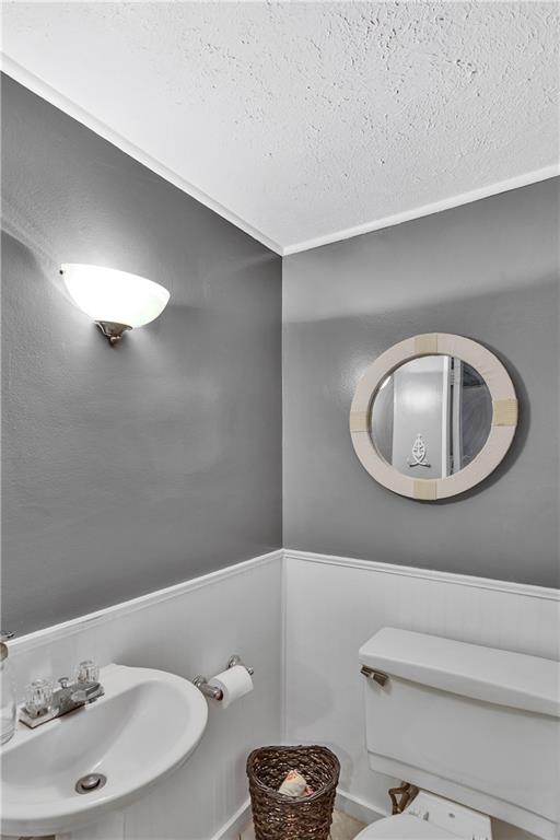 645 Blue Ridge Road Pittsburgh, PA 15239 - Photo 20 of 27 a bathroom with a sink a toilet and a mirror