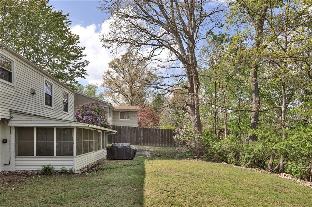 645 Blue Ridge Road Pittsburgh, PA 15239 - Photo 24 of 27 a view of a house with a yard and large trees