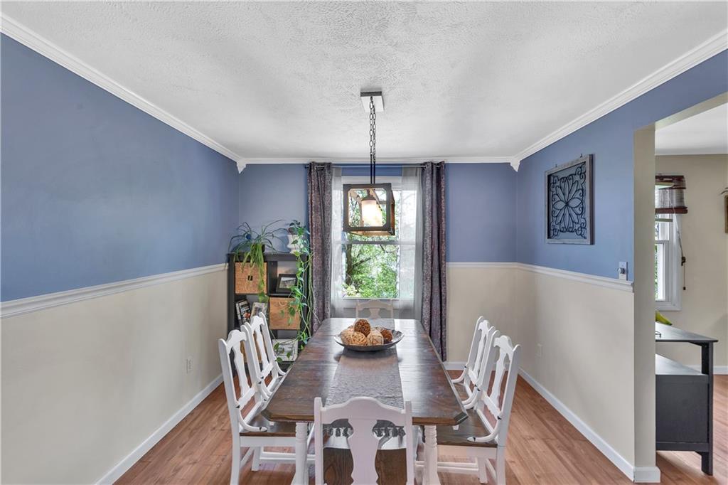 645 Blue Ridge Road Pittsburgh, PA 15239 - Photo 5 of 27 a view of a dining room with furniture window and wooden floor