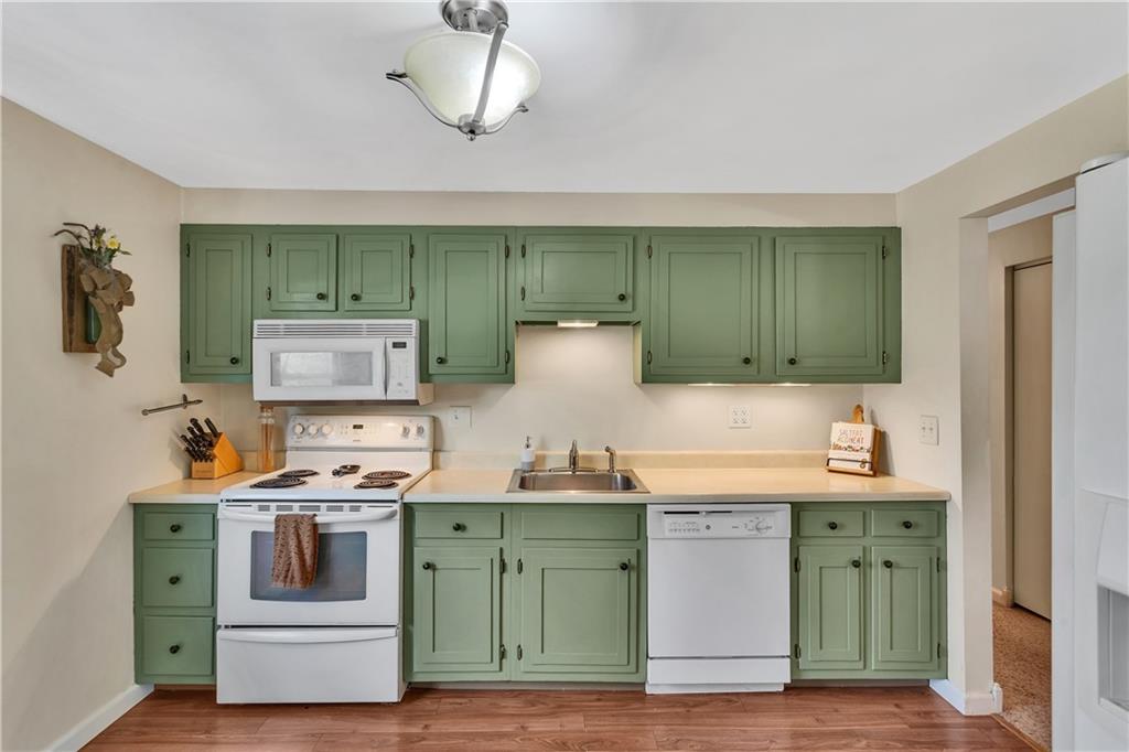 645 Blue Ridge Road Pittsburgh, PA 15239 - Photo 8 of 27 a kitchen with a stove and a sink