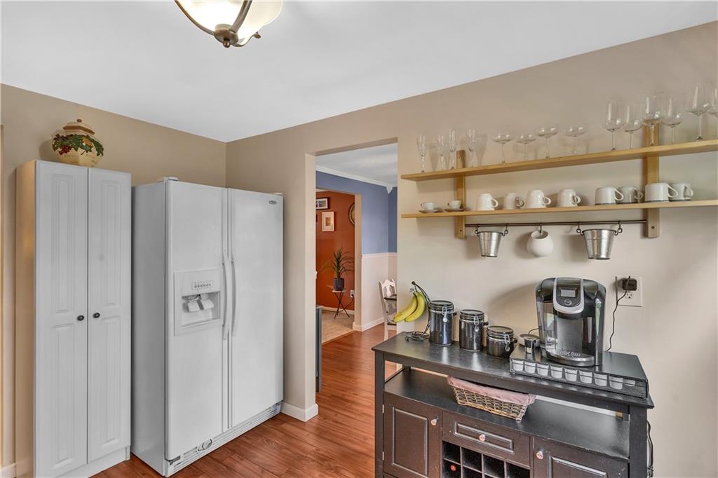 645 Blue Ridge Road Pittsburgh, PA 15239 - Photo 9 of 27 a kitchen with stainless steel appliances granite countertop a refrigerator and a stove top oven