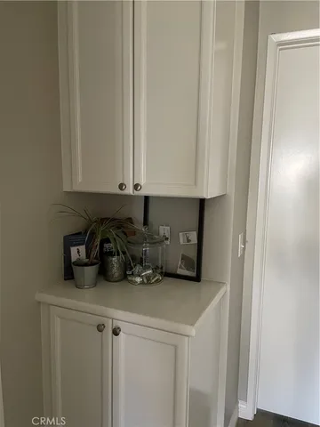 a view of cabinets and microwave