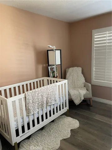 a bed room with two beds and a window