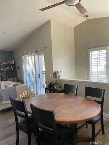a view of a dining room with furniture and window