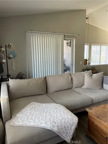 a living room with a couch and a large window