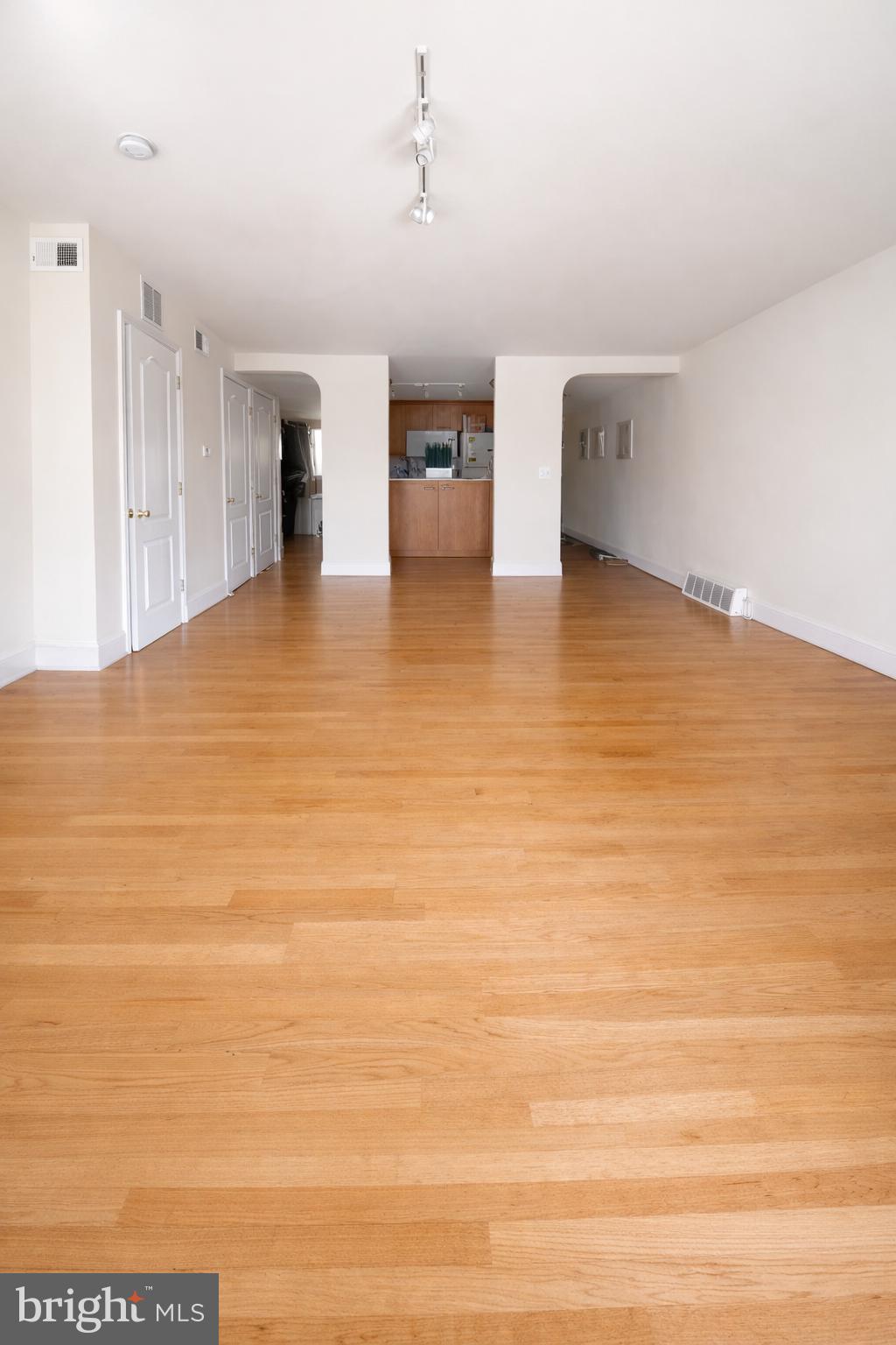 1701-03 Spruce Street, Unit 4F Philadelphia, PA 19103 - Photo 3 of 7 a view of empty room with wooden floor