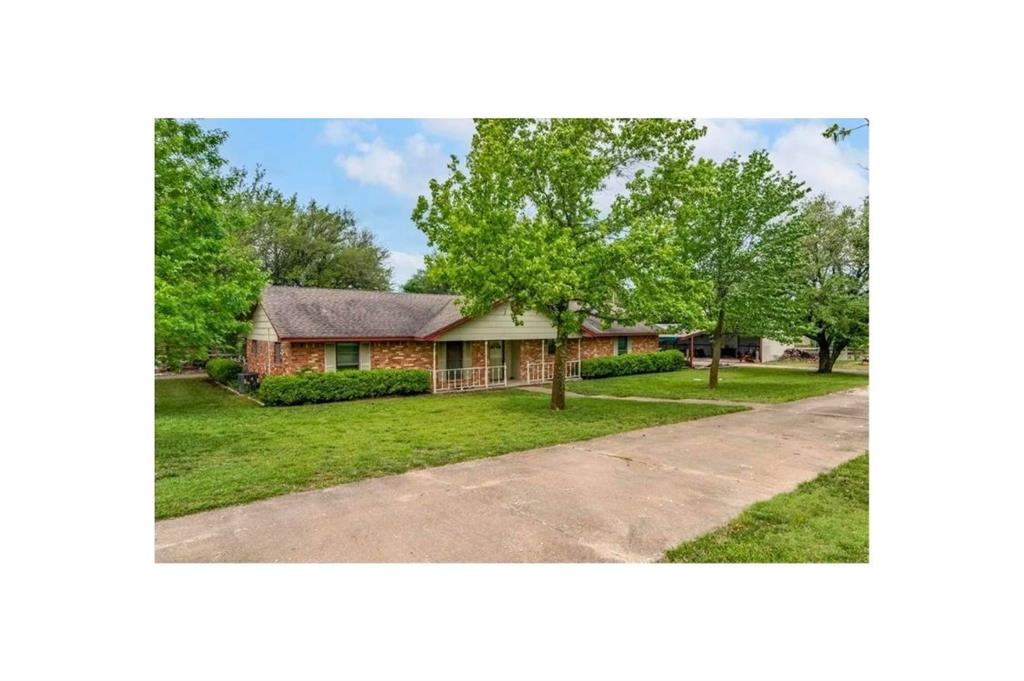14329 Highway 75 Van Alstyne, TX 75495 - Photo 2 of 2 a view of a garden with a house