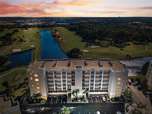an aerial view of a house with a ocean view