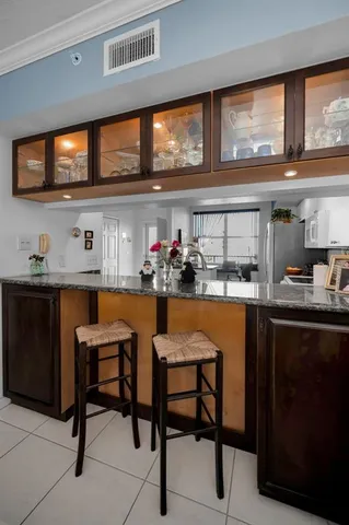 a view of a balcony with a table and chairs