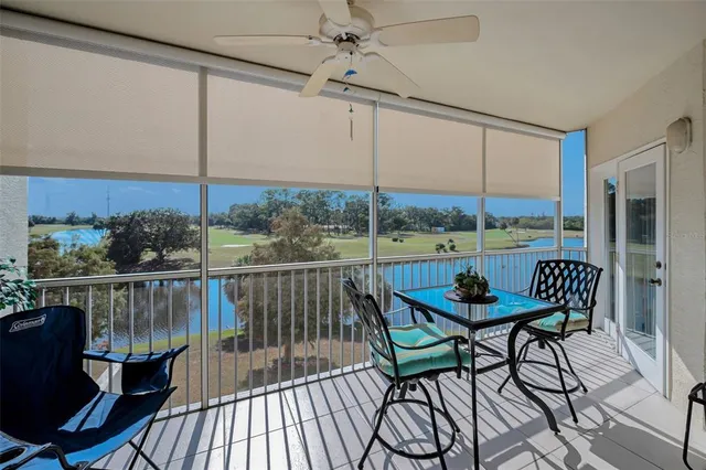 a view of a lake with houses in the back