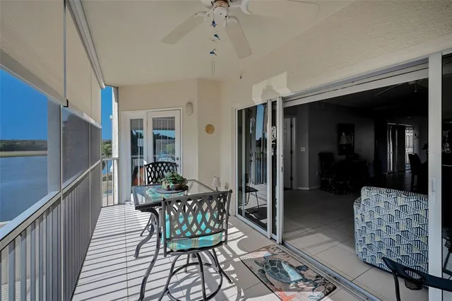 a view of a lake with houses in the back