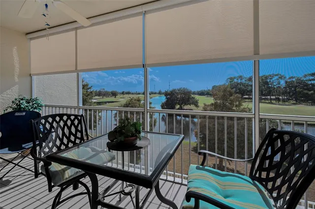 a view of a house with swimming pool and sitting area