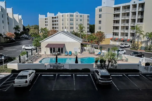a kitchen with granite countertop white cabinets and stainless steel appliances