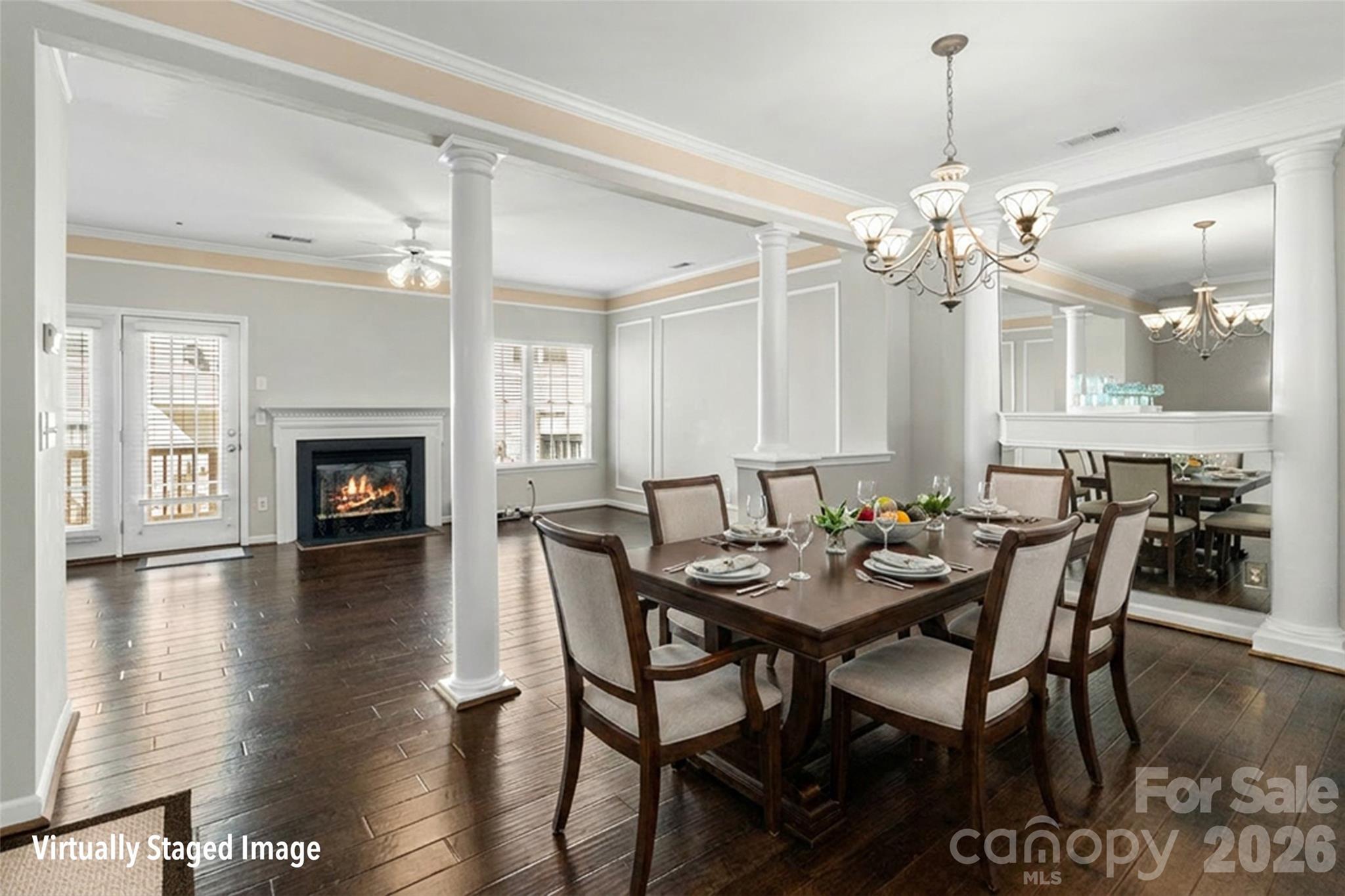 104 Rock Ridge Lane Mount Holly, NC 28120 - Photo 16 of 48 a view of a a dining room with furniture wooden floor and chandelier