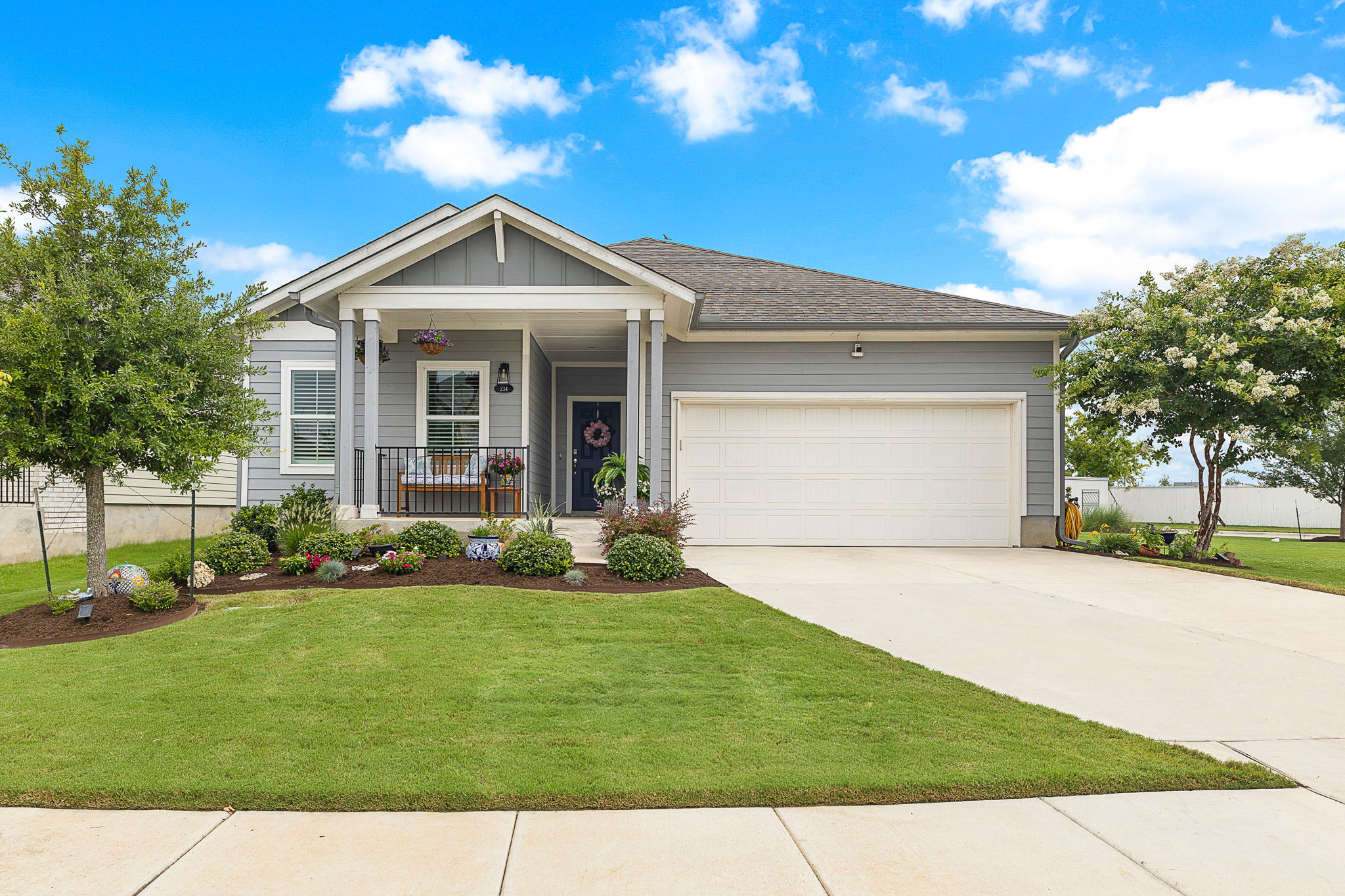 234 Appleberry Lane Elgin, TX 78621 - Photo 5 of 28 Set on an oversized corner lot, this home makes a polished first impression with manicured landscaping and a clean, welcoming exterior.