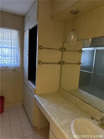 a bathroom with a tub and sink