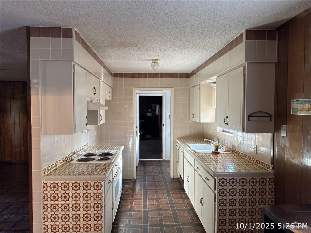 421 Longshadow Road Laredo, TX 78041 - Photo 2 of 13 a bathroom with a granite countertop sink a large mirror and a shower