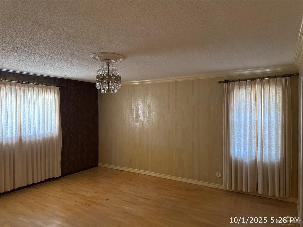 421 Longshadow Road Laredo, TX 78041 - Photo 5 of 13 an empty room with chandelier fan and windows