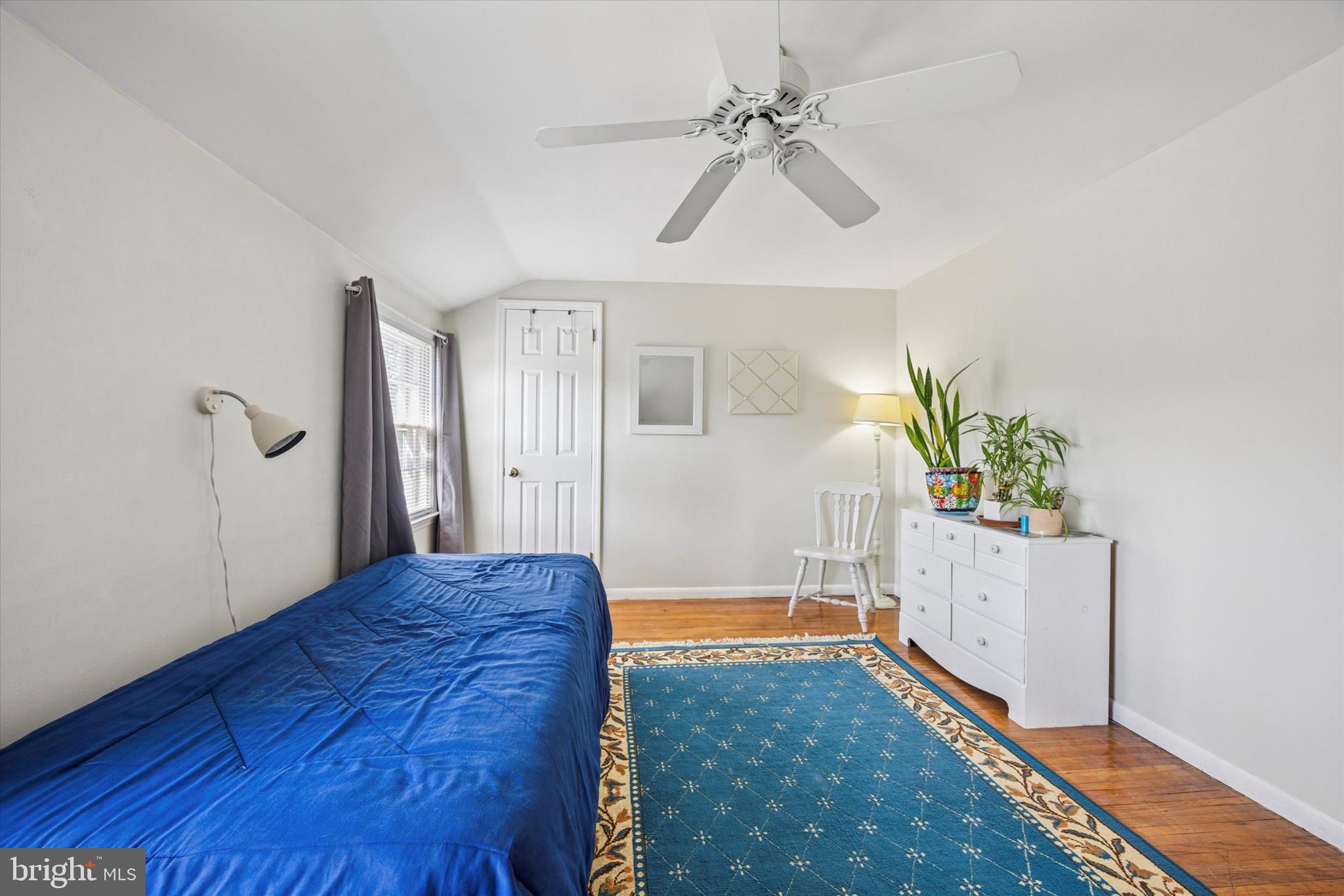 111 Wayside Drive Cherry Hill, NJ 08034 - Photo 17 of 28 a spacious bedroom with a bed and a chandelier