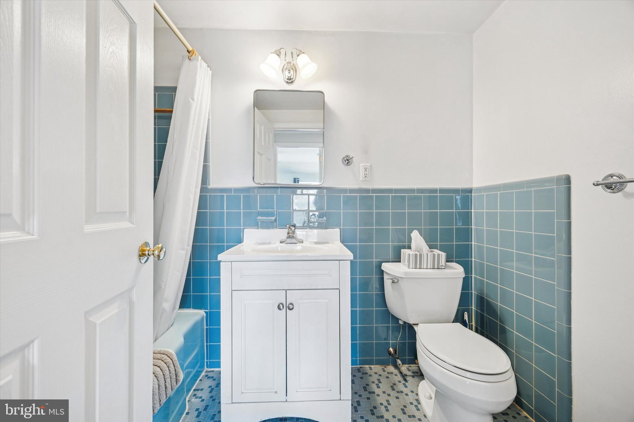 111 Wayside Drive Cherry Hill, NJ 08034 - Photo 18 of 28 a bathroom with a sink a toilet and a mirror