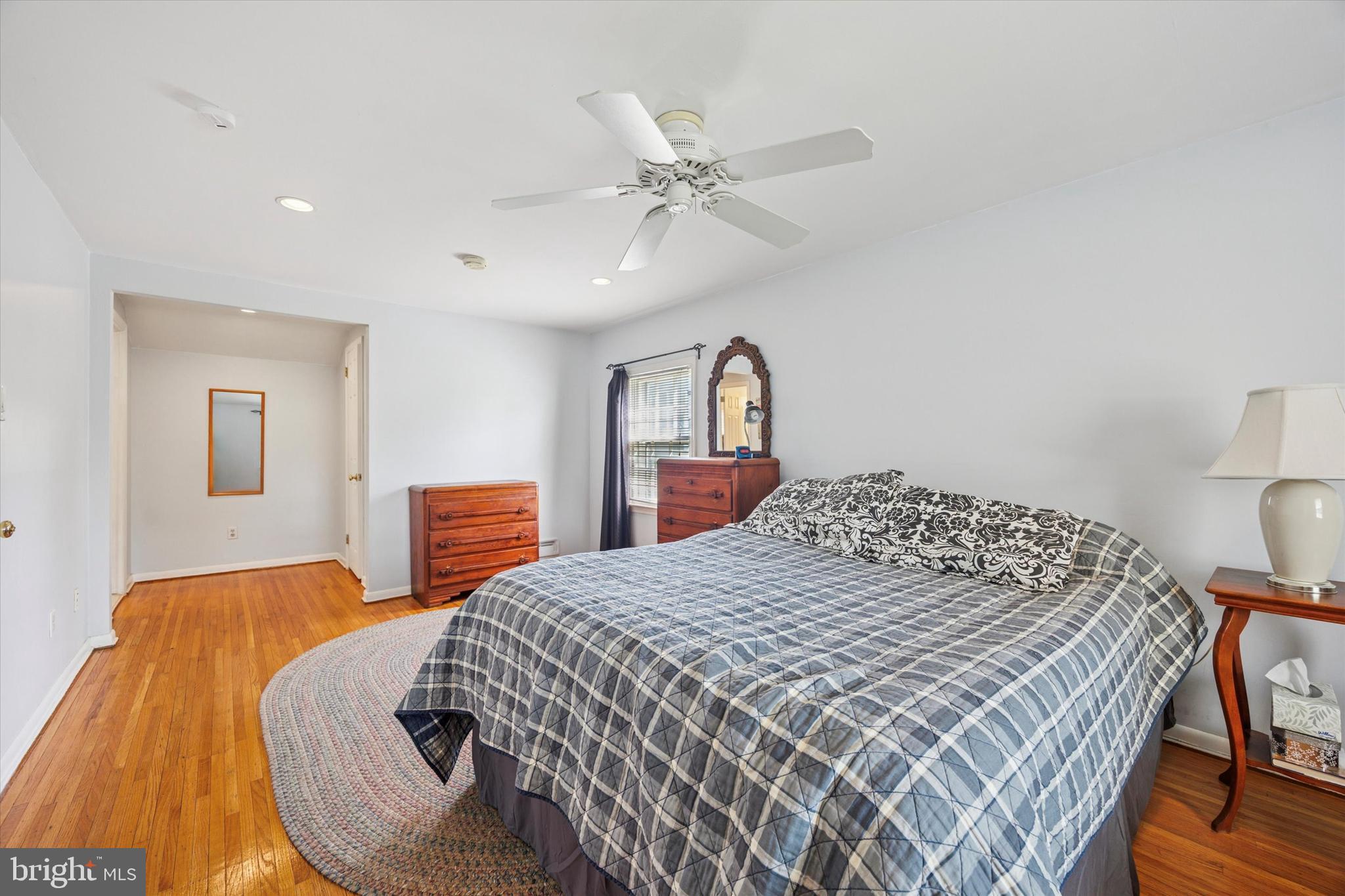 111 Wayside Drive Cherry Hill, NJ 08034 - Photo 21 of 28 a bedroom with a large bed and a chandelier
