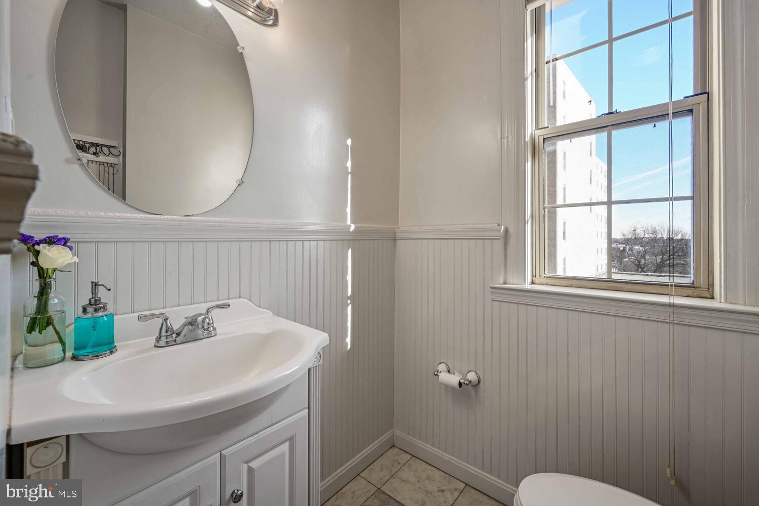 1401 Columbia Road Northwest, Unit 414 Washington, DC 20009 - Photo 16 of 18 Bright and airy bathroom with classic charm.