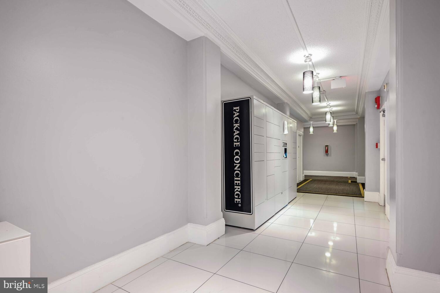 1401 Columbia Road Northwest, Unit 414 Washington, DC 20009 - Photo 3 of 18 Modern entryway with package concierge system.
