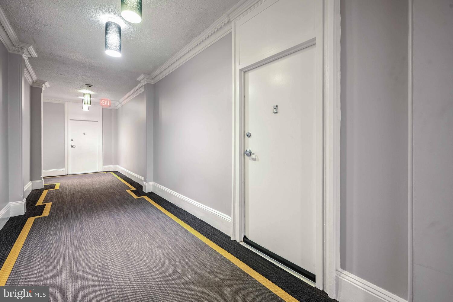 1401 Columbia Road Northwest, Unit 414 Washington, DC 20009 - Photo 4 of 18 Modern corridor with sleek design elements.