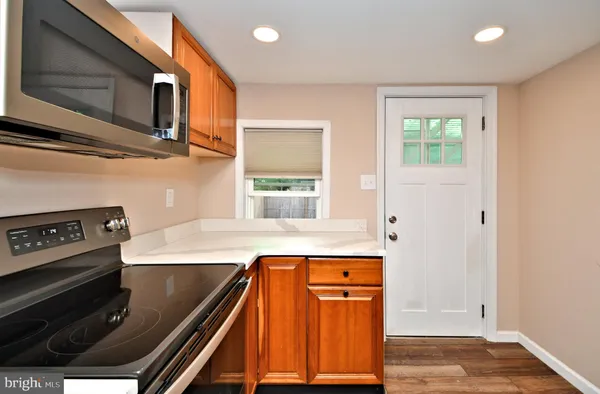 a kitchen with a sink and a refrigerator