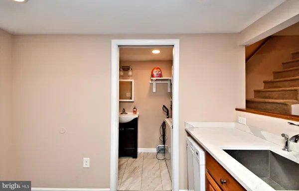 a kitchen with granite countertop stainless steel appliances and wooden cabinets