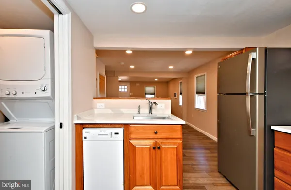 a bathroom with a sink mirror and toilet