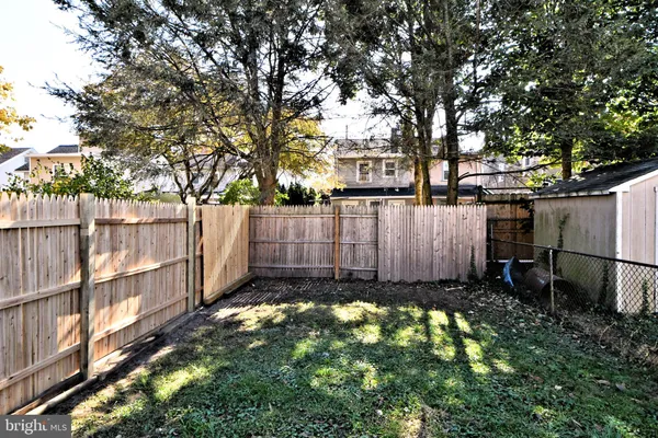 a view of a house with a yard porch and sitting area