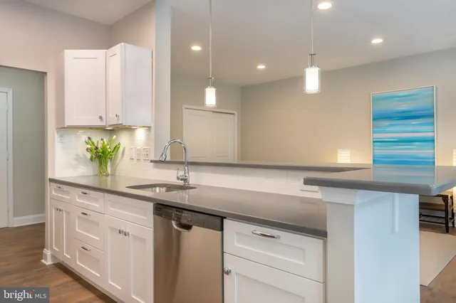 a kitchen with a sink and cabinets