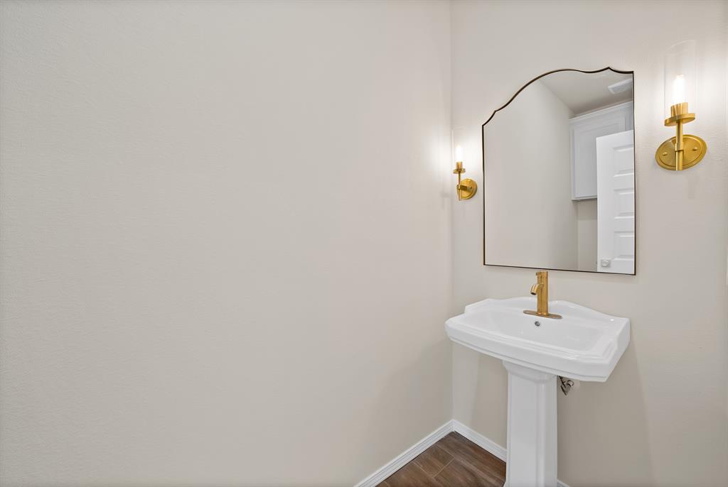501 Harris Road Azle, TX 76020 - Photo 11 of 29 a bathroom with a sink and a mirror