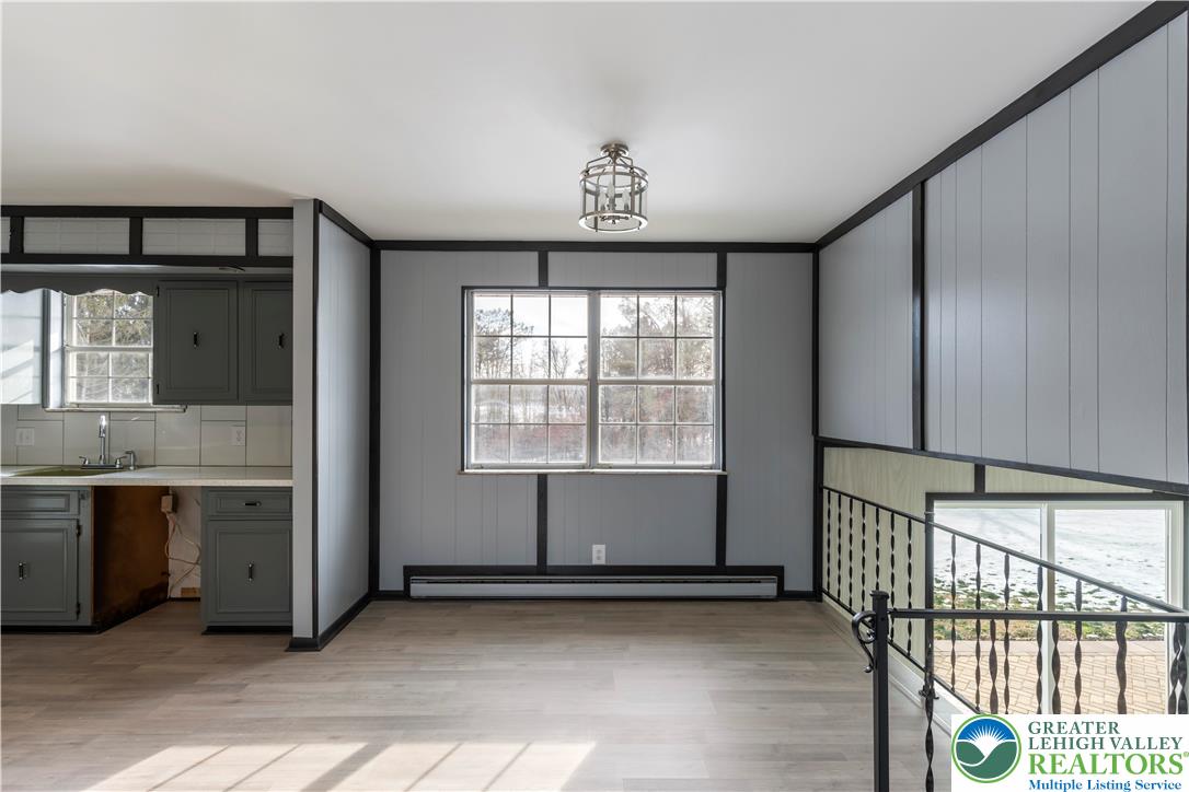 438 Nursery Road Kempton, PA 19529 - Photo 11 of 38 a view of a kitchen with a sink and large window