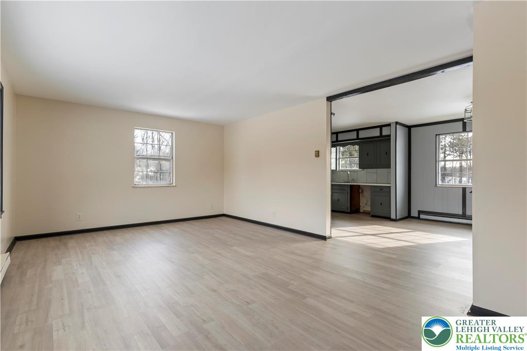 438 Nursery Road Kempton, PA 19529 - Photo 14 of 38 a view of an empty room with window and wooden floor