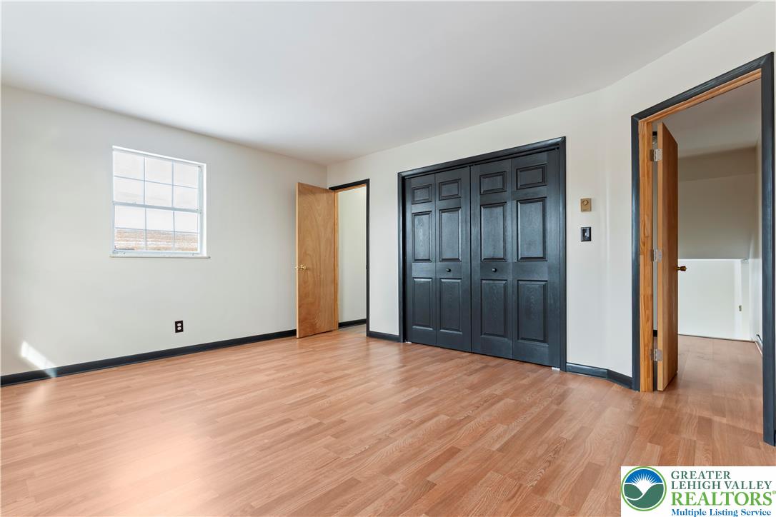 438 Nursery Road Kempton, PA 19529 - Photo 18 of 38 an empty room with wooden floor and windows