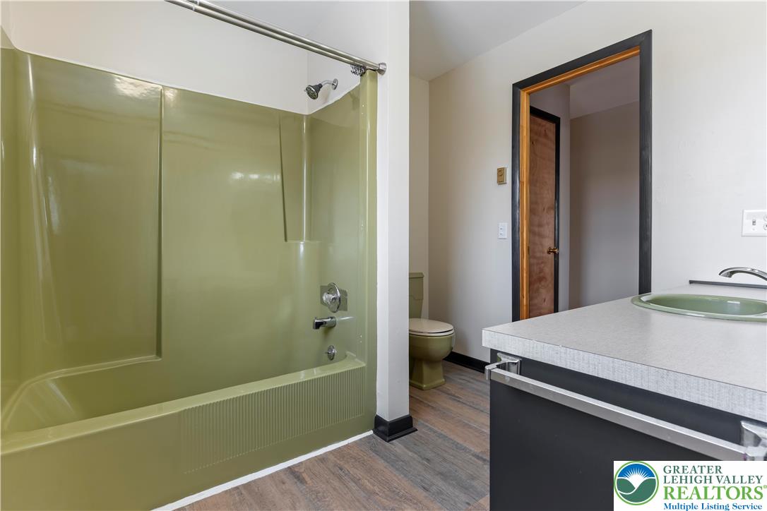 438 Nursery Road Kempton, PA 19529 - Photo 21 of 38 a bathroom with a sink and a mirror