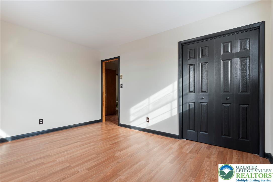 438 Nursery Road Kempton, PA 19529 - Photo 22 of 38 an empty room with wooden floor