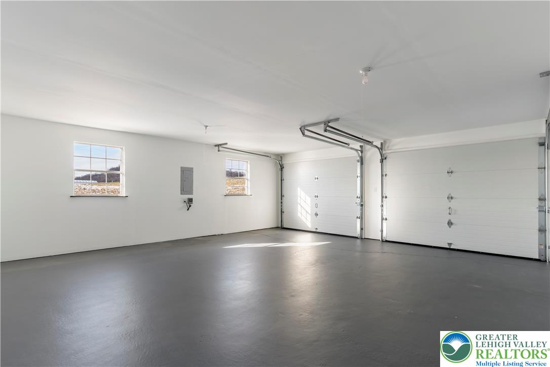 438 Nursery Road Kempton, PA 19529 - Photo 30 of 38 an empty room with wooden floor and windows