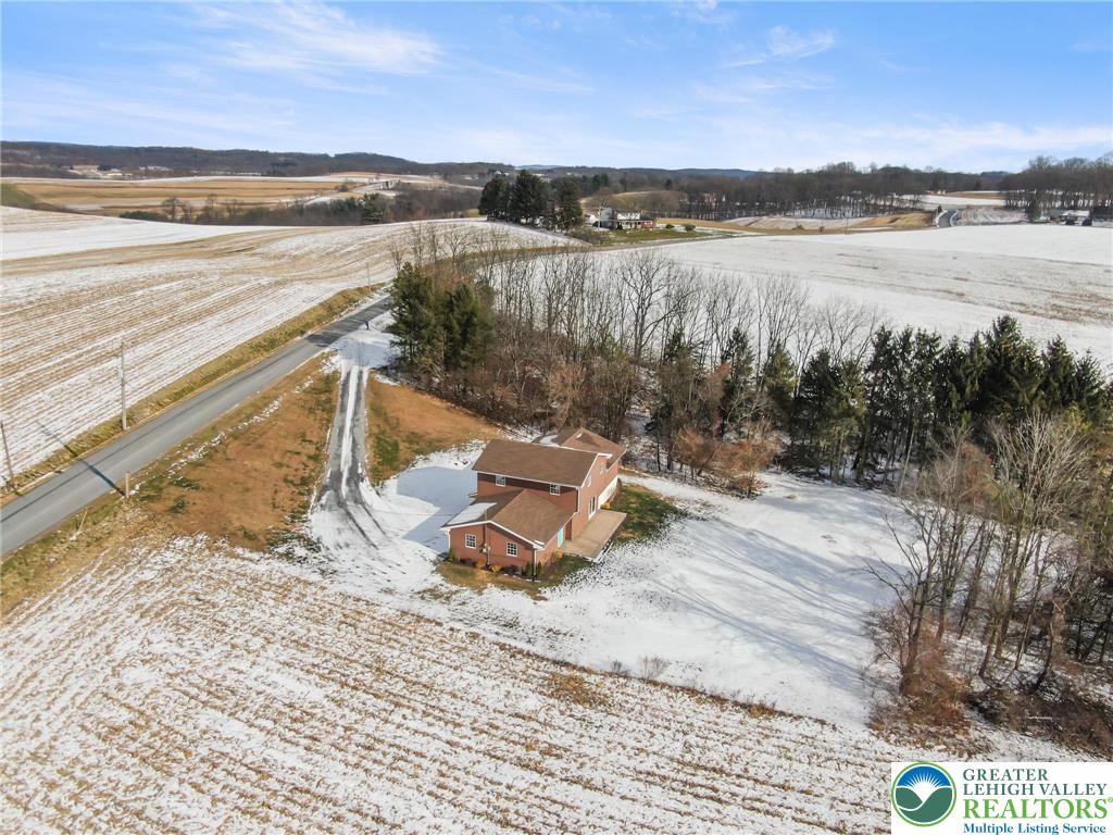 438 Nursery Road Kempton, PA 19529 - Photo 37 of 38 a view of a lake with a beach
