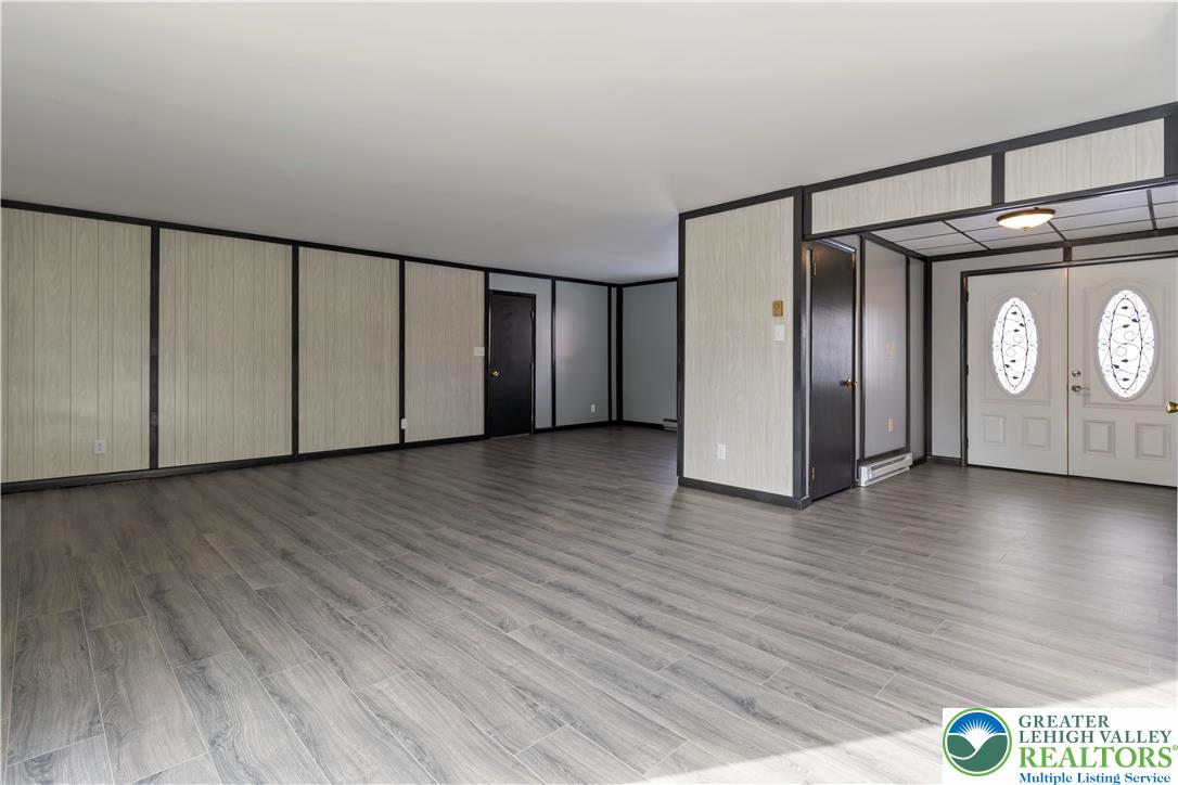 438 Nursery Road Kempton, PA 19529 - Photo 6 of 38 a view of a hallway with wooden floor