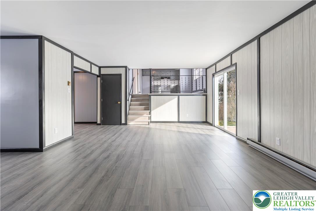 438 Nursery Road Kempton, PA 19529 - Photo 8 of 38 a view of empty room with wooden floor and window