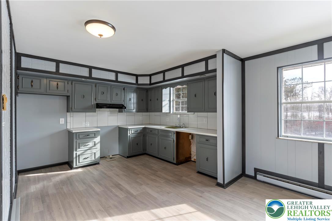 438 Nursery Road Kempton, PA 19529 - Photo 10 of 38 a kitchen with a refrigerator sink and stove