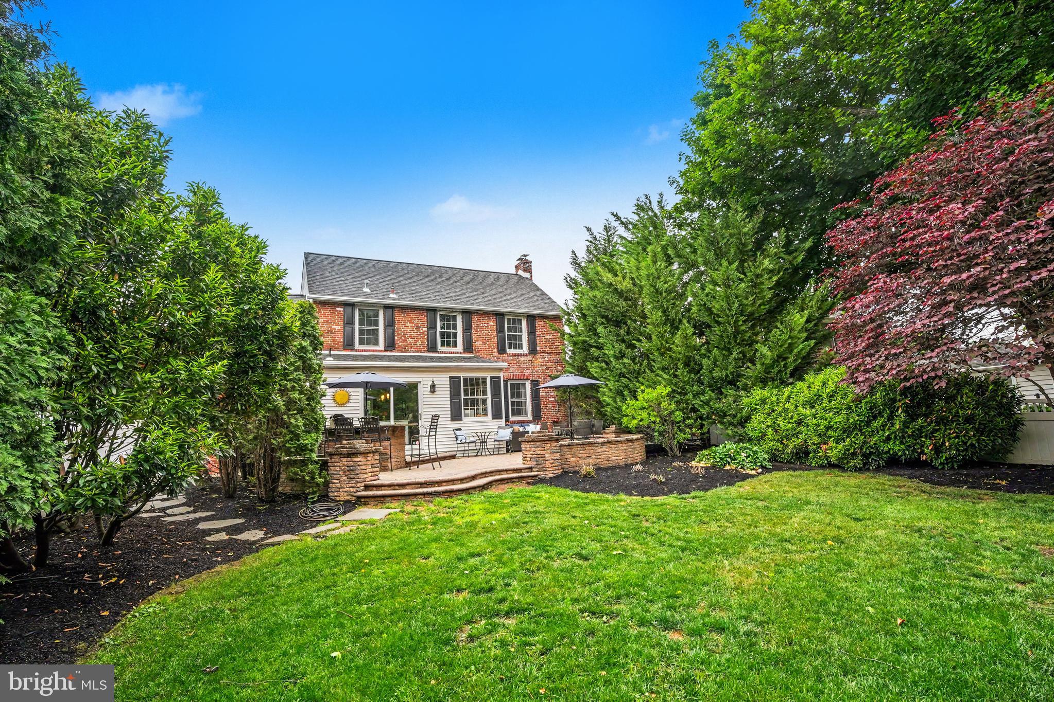 235 Hopkins Road Haddonfield, NJ 08033 - Photo 42 of 47 a view of a house with a backyard porch and sitting area