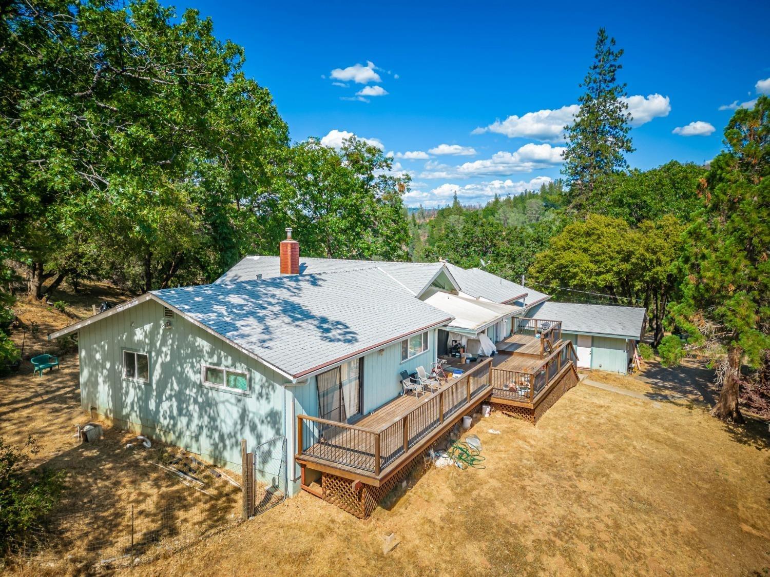 18840 Dog Bar Road Grass Valley, CA 95949 - Photo 1 of 1 an aerial view of a house with roof deck front of house